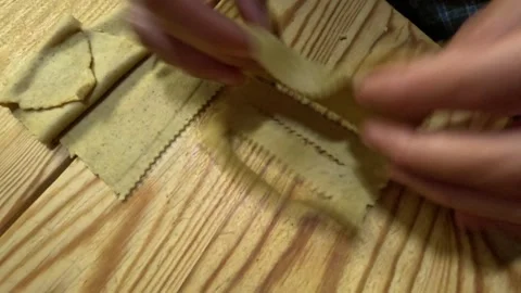 Hands shaping Chabakia dough into spirals and flower-like twists. Video stock 331091389