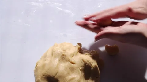 Hands shaping cookie dough on a white background. Baking concept for home Video stock 303589641