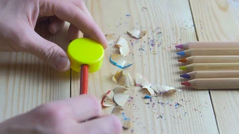 Hands sharpen a wooden pencil Stock Footage