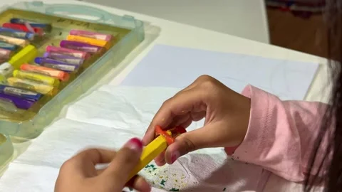 Hands sharpening colorful crayon, art supplies on table, Stock Footage 342748053