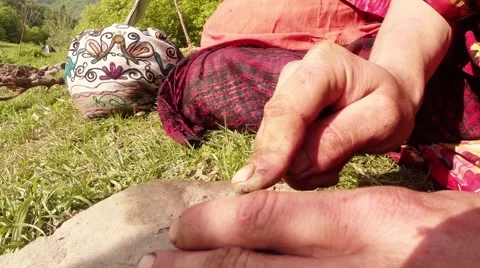 Hands Sharpening Iron Object on the Grindstone in the Mountains on Nature Close Stock Footage 63995809