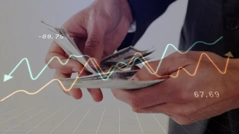 Hands shifting dollar stack after pause sliding bills between thumbs, updating Stock Footage 318194381