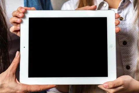 Hands showing digital tablet blank screen  - Mockup image Stock Photos