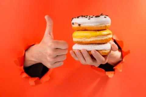 Hands showing donuts Stock Photos