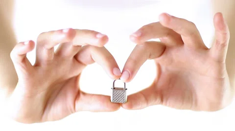 Hands Showing  miniature lock, concept of safety Stock Footage 34866028