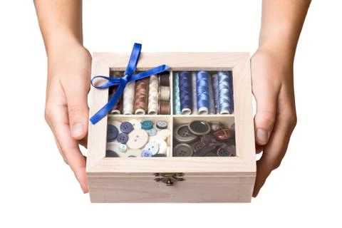 Hands showing sewing box Stock Photos