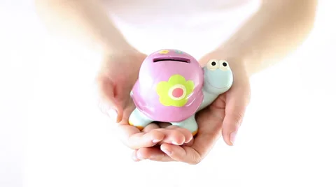 Hands showing small smiling turtle piggy bank Stock Footage 34866034
