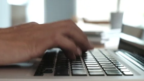 Hands is shown typing on a laptop Stock Footage 77894289