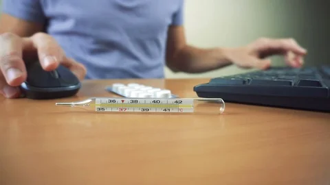 Hands of sick man typing on keyboard and working in office Stock Footage 83432512