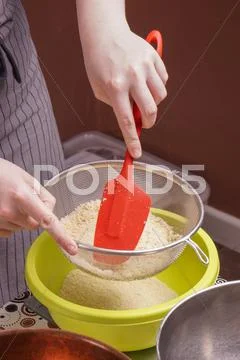 Hands Sifts Almond Flour For Cake Baking