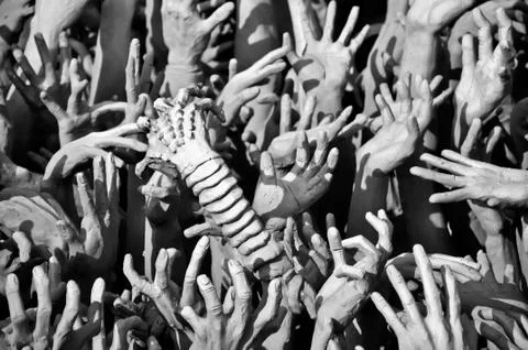 Hands of sin men and alien in hell Stock Photos