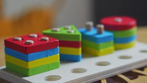 Hands skillfully manipulate colorful construction pieces Stock Footage 266751234