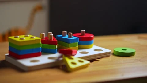 Hands skillfully manipulate colorful construction pieces Stock Footage 266751277