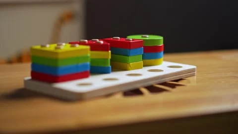 Hands skillfully manipulate colorful construction pieces Stock Footage 266751296