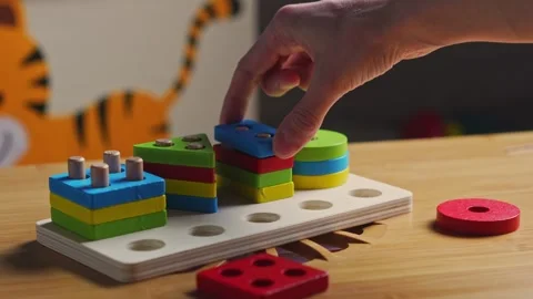 Hands skillfully manipulate colorful construction pieces Stock Footage 266751328