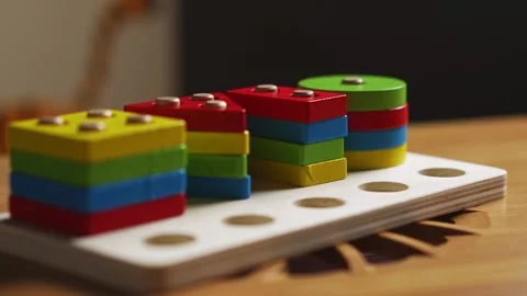 Hands skillfully manipulate colorful construction pieces Stock Footage 266751382