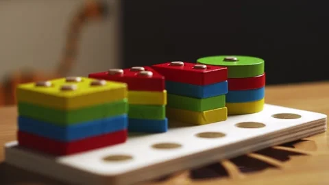 Hands skillfully manipulate colorful construction pieces Stock Footage 266751383