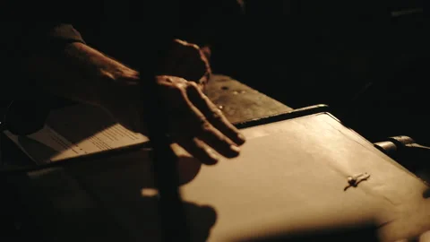 Hands skillfully operating machine to process papers at a work station Stock Footage 320024905