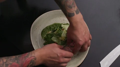 Hands slice cut food on plate with knife dish seasoning tasty soup healthy meal Stock Footage 103290933