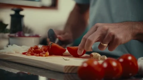 Hands slice tomato with knife on cutting board Stock Footage 334223409