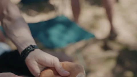 Hands Slicing A Crusty Bread Roll With A Pocket Knife Outdoors Stock Footage 340595673