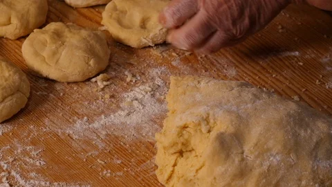 Hands slicing dough for dessert Stock Footage 98694186