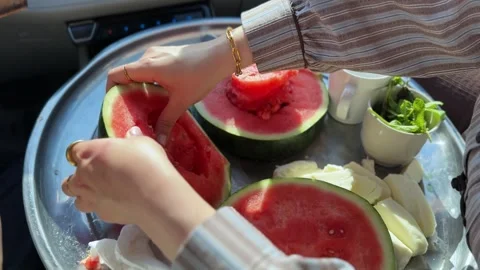 Hands Slicing Fresh Watermelon On Tray In Car Stock Footage 337618412