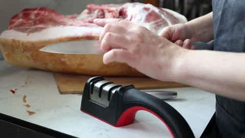 Hands Slicing Raw Pork on Cutting Board for Home Meat Preparation Stock Footage 343249833