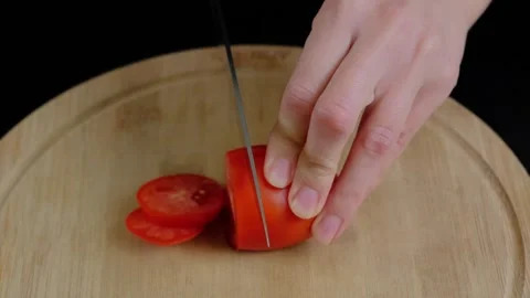 Hands Slicing Red Tomato on Cutting Board in Cooking Kitchen Video stock 341426417