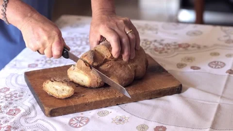 Hands slicing traditional Matera bread, Italy  Stock Footage 284227084