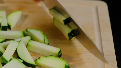 Hands slicing zucchini on cutting board in Cooking kitchen Video stock 341418959