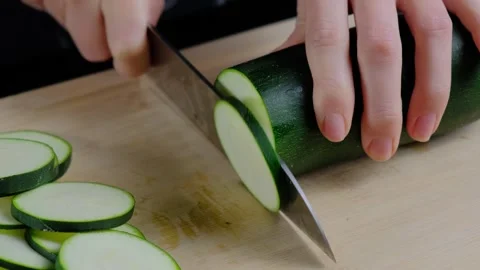 Hands Slicing Zucchini on Cutting Board Cooking Stock Footage 341428043