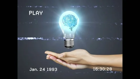 Hands sliding in glitching PLAY icon timecode cupping forming brain bulb pulsing Video stock 317128300
