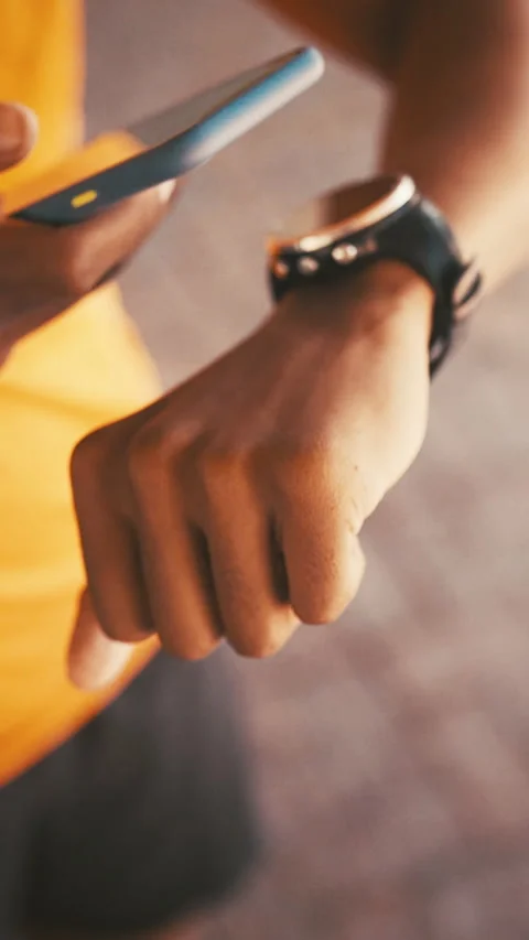 Hands, smart watch and phone for fitness in city with timer, scan and digital Stock Footage 329766061