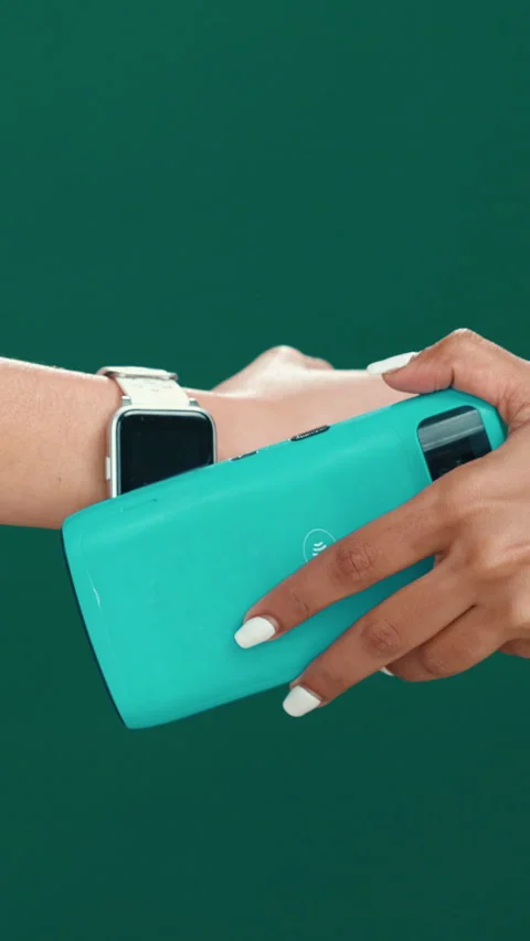Hands, smart watch and pos in studio for payment, deal or fintech app for tap on Stock Footage 320100073