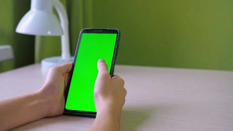 Hands with a smartphone close-up. flips his finger across the screen. a teenager Video stock 166110298