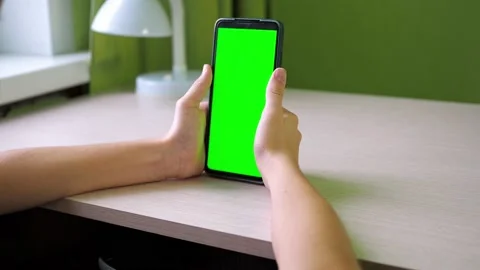 Hands with a smartphone close-up. flips his finger across the screen. a teenager Stock Footage 167904835