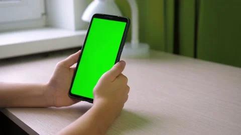 Hands with a smartphone close-up. taps the screen with his finger. a teenager is Stock Footage 168966389