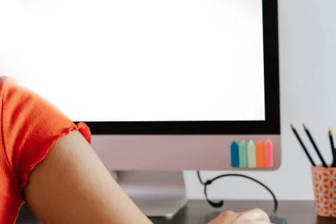 A Hands with smartphone working on computer at her home office Foto stock