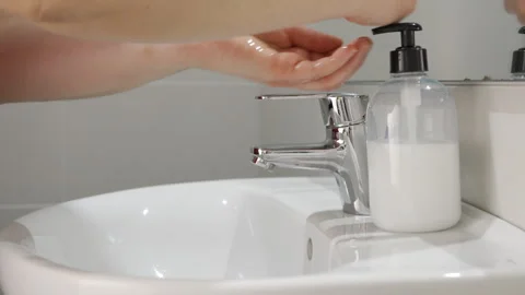 Hands with soap and turning off the tap to Stock-Footage 277805361