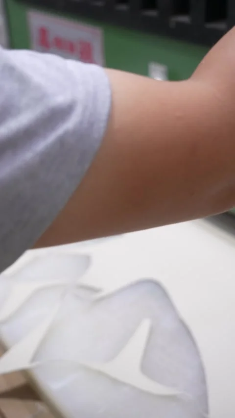 Hands Sort Cut Footwear Material Pieces in Factory Vertical Video Stock Footage 340182691