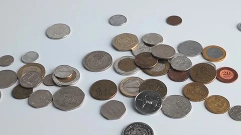 Hands sort different coins on a table in a simple arrangement process Stock Footage 338120873