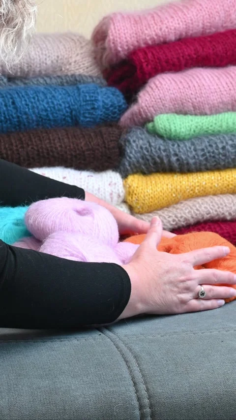 Hands sorting soft yarn balls. Stock Footage 334749381