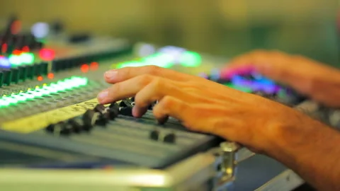 Hands of the sound engineer on the remote control Stock Footage 97146056