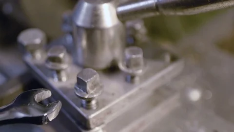 Hands with spanner rotate screw Stock Footage 70801773