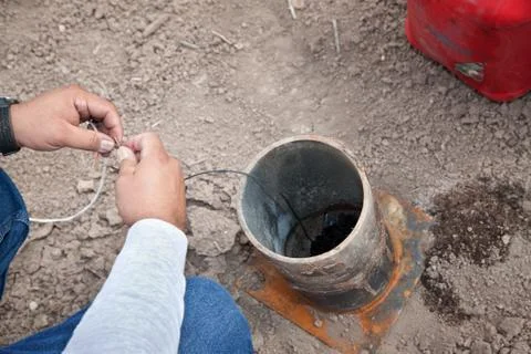 Hands of Special Effects Worker and Tube Stock Photos