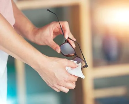 Hands, spectacles and cleaning for sight, vision or eyewear hygiene to see Stock Photos