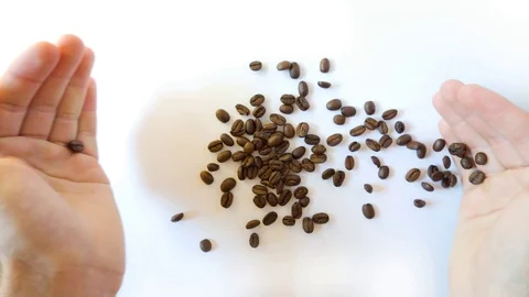 Hands spilling coffee beans out Stock Footage 116748363