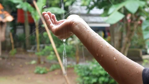 Hands with splashes of falling rain Stock Footage 301222830