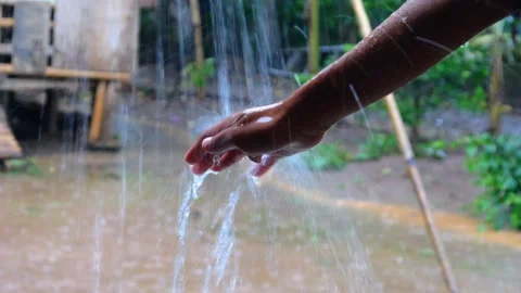 Hands with splashes of falling rain Stock Footage 301222837